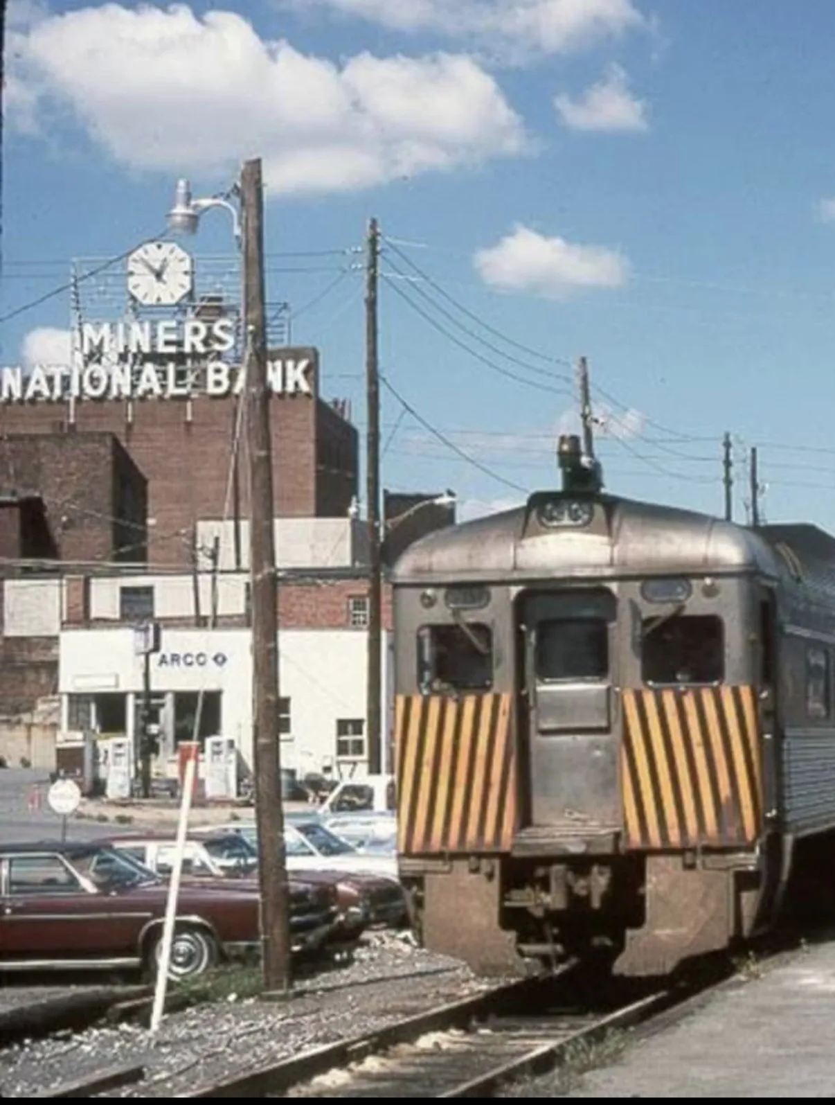 The Miners National Bank building in downtown Pottsville, its rooftop sign and clock overlooking the street