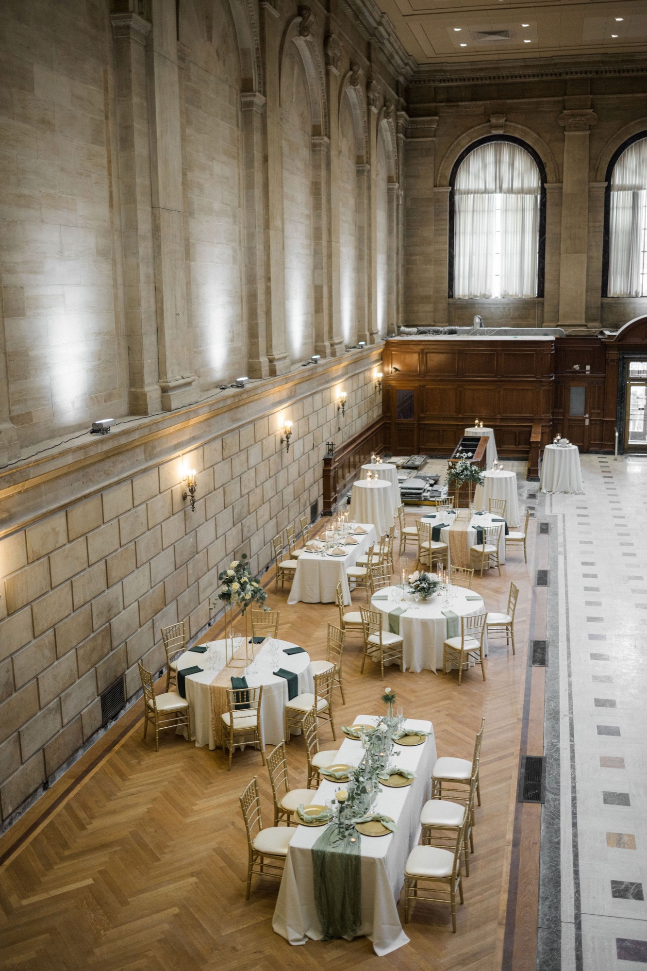 Aerial view of the Bank Lobby from the mezzanine level, showing the full scope of the vaulted ceilings and marble floors
